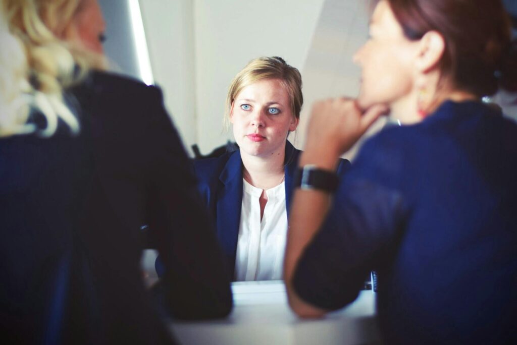 Woman in Between Colleagues